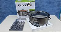 Slow cooker with lid, knife set and product box