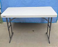 Full view of open table showing tabletop and legs