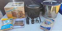 Overall lot with toaster box, roaster oven, stock pot, coffee filters, pastry scraper, small tools