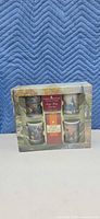 Front of sealed Thomas Kinkade mug set box showing four mugs