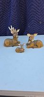 Front view of all three deer figurines