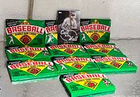 Front view of ten sealed Bowman packs and Babe Ruth card