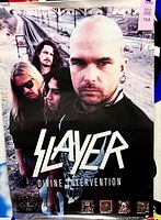 Full view of poster showing band photo, logo and album title