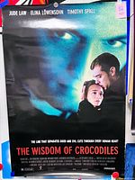 Full view of poster showing title, actors, tagline, overall wear