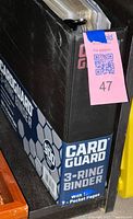 Binder spine showing CardGuard branding and original sleeve indicating 3-ring binder with nine-pocket pages