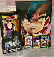 Boxed Ultimate Gohan figure, lenticular poster, three booster packs grouped
