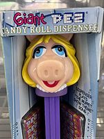 Front of boxed Miss Piggy PEZ dispenser showing character head and product details