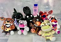 Front view of all eight Five Nights at Freddy’s plush toys displayed together