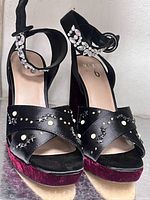 Front view of Mix No. 6 heels showing strap design, stud and pearl embellishments, velvet platform