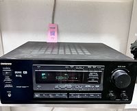 Front angled view of Onkyo TX-DS575X receiver showing overall condition