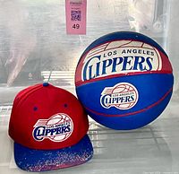 Basketball and cap together showing logos and colours