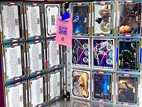 Binder opened with pages of card backs and fronts