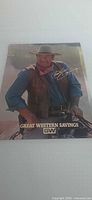 Full view of poster showing John Wayne image and Great Western Savings logo