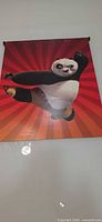 Full view of Kung Fu Panda 2 hanging poster showing Po against red radial background