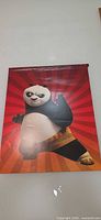 Front view of Kung Fu Panda 3 poster showing Po on red background
