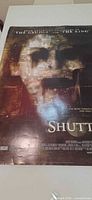 Full view of Shutter movie poster showing artwork and wear