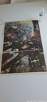 Full view of folded Star Wars poster on table showing overall image and size