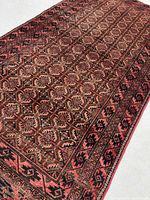 Full angle view of Balouchi rug showing pattern and borders