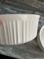 Close-up of side and rim detailing on one dish