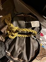 Top view of bag showing yellow nylon rope and metal clip attached to hanging ring