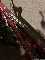 Close-up of top tube showing Scrambler branding and red frame