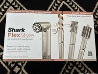 Retail box front showing product and attachment images