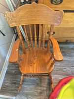 Front view of oak rocking chair
