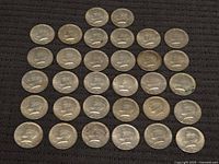 All 28 Kennedy half dollars displayed obverse side