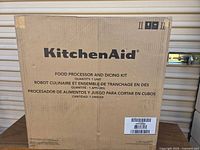 Front view of sealed KitchenAid food processor and dicing kit box