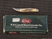Knife on top of branded box, full view