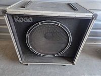 Front view of Road speaker cabinet showing grille and logo