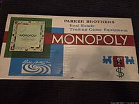 Front of sealed Monopoly box showing branding and shrink-wrap