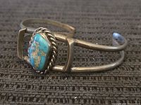 Full view of sterling cuff bracelet showing turquoise stone and frame detail