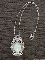Full view of sterling silver necklace with pendant and chain