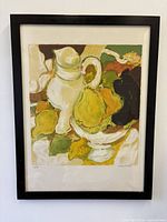 Framed lithograph front view showing artwork, mat and black frame