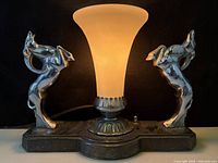 Front view showing full lamp, gazelle figures, illuminated shade