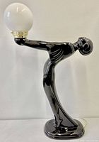 Full view lamp unlit showing figure and globe