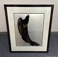 Full view of framed Erte print upright