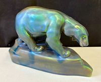 Front view of iridescent porcelain sculpture showing two polar bears