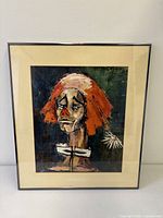Framed clown art print under glass, front view