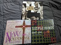 Front covers of three Simple Minds albums