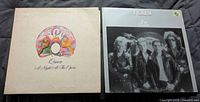 Front covers of both Queen albums