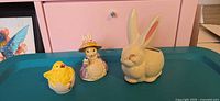 Group shot: bunny planter, dressed bunny figurine, chick in eggshell