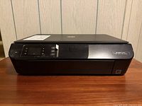 Front view of HP Envy 4500 printer showing control panel and branding