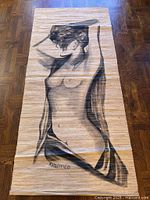 Overall view of bamboo wall hanging with charcoal nude figure, signature visible