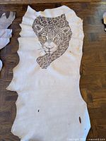 Entire leather hide showing size and leopard illustration placement