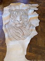 Full view of leather hide showing entire tiger portrait