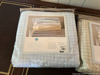 Sealed light blue blanket package front