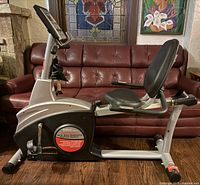 Full side view of Schwinn recumbent exercise bike showing seat, frame, console