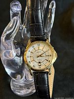 Front view of Seiko Premier watch on stand